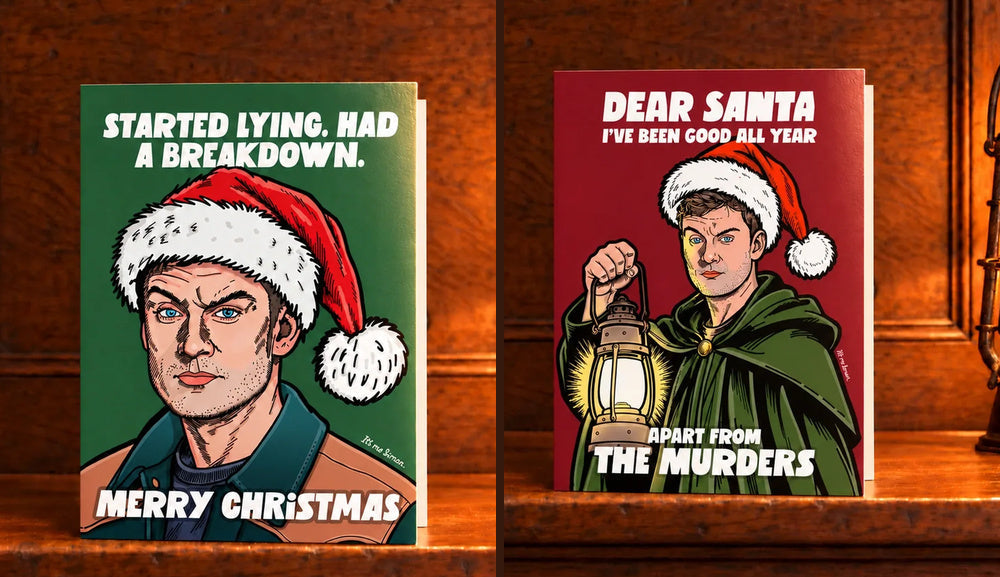 Two illustrated James Acaster Celebrity Traitors Christmas cards, Started Lying and Dear Santa, standing on wooden mantelpieces beside warm glowing lamps.