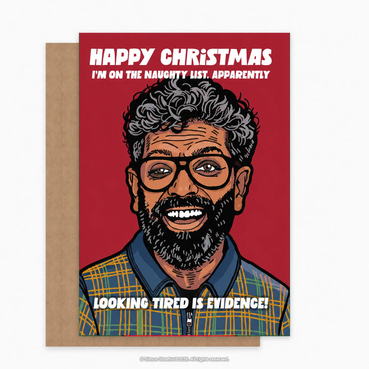 Romesh Ranganathan Christmas card with a red background: I’m on the naughty list. Apparently, looking tired is evidence. Shown with a brown kraft envelope peeking out to the left on a light grey background.