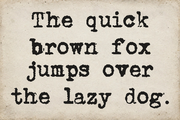 Type Old Writer font on aged white paper: The quick brown fox jumps over the lazy dog.