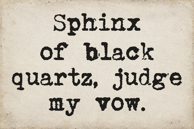 Type Old Writer font on aged white paper: Sphinx of black quartz, judge my vow.